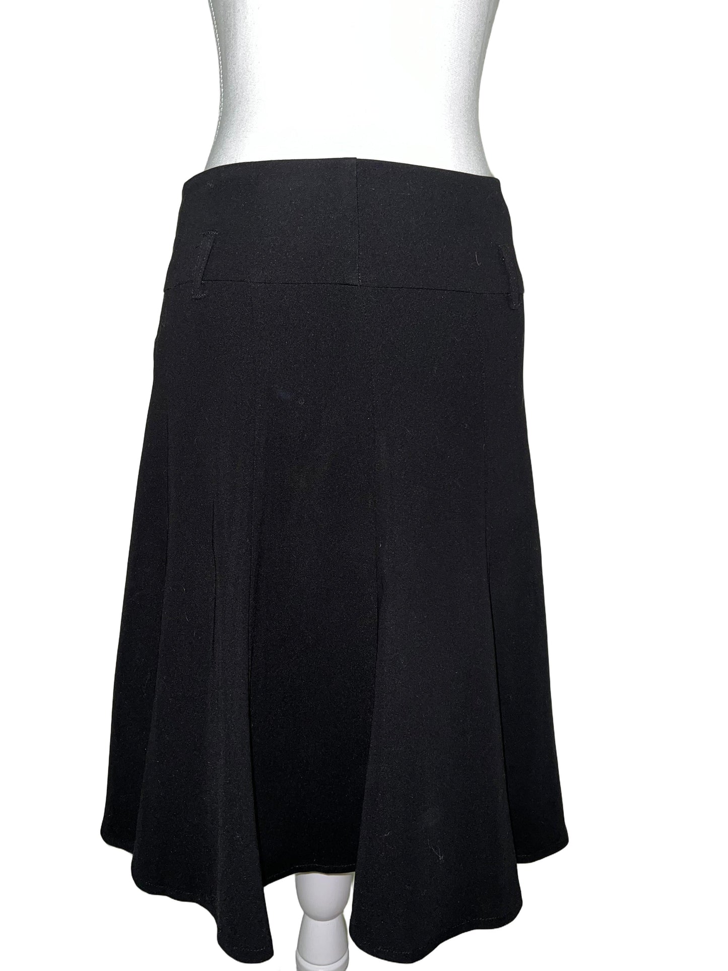 Black flowy midi skirt, size 12, on a mannequin. Softly flared silhouette, lightweight fabric.