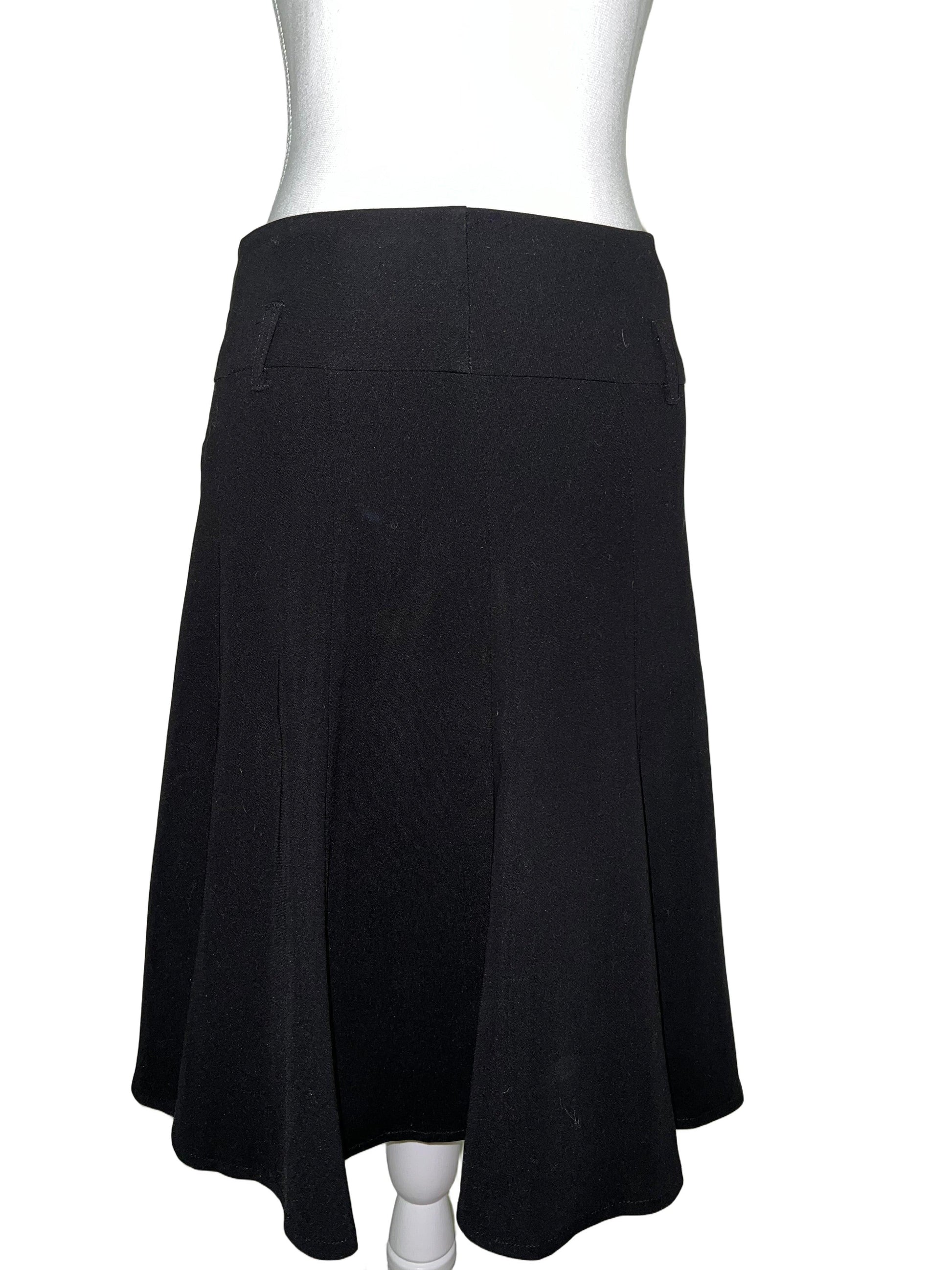 Black flowy midi skirt, size 12, on a mannequin. Softly flared silhouette, lightweight fabric.
