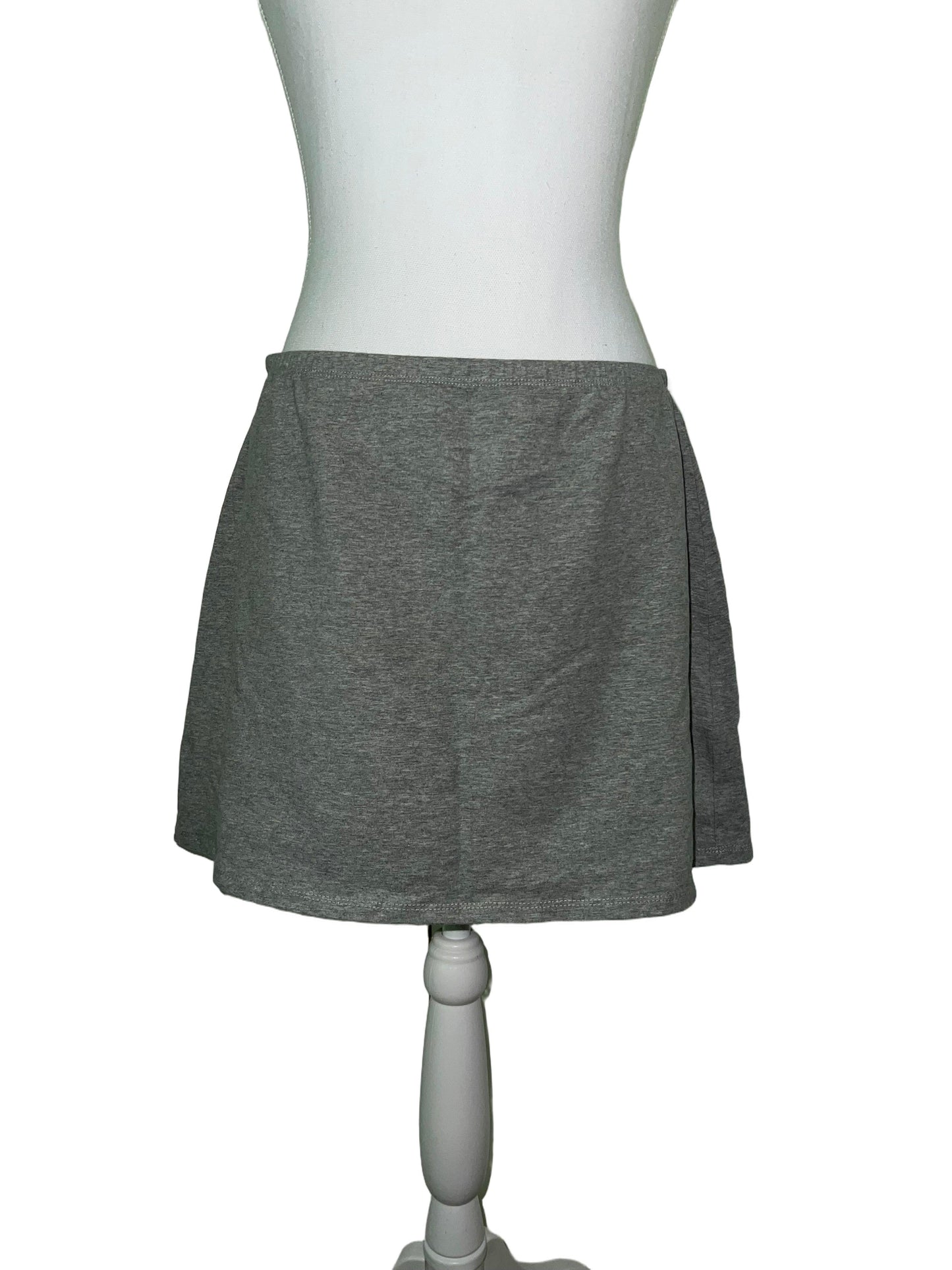 Light grey stretch mini skirt, size M, on a mannequin.