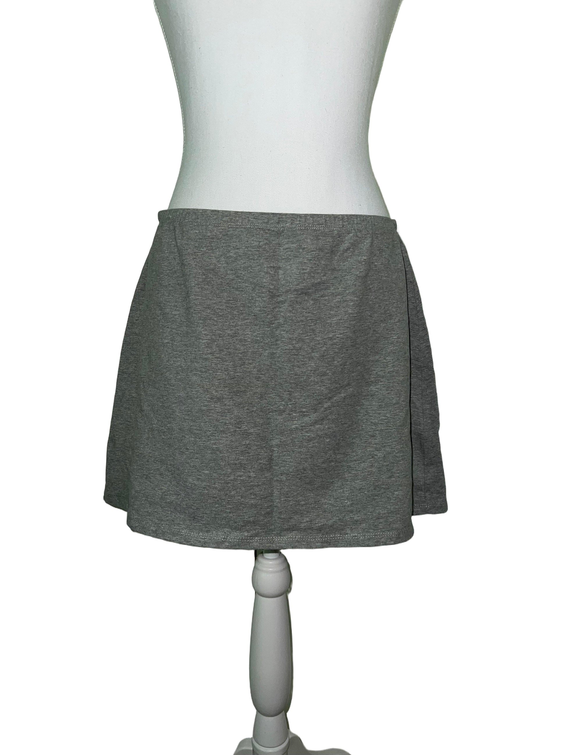 Light grey stretch mini skirt, size M, on a mannequin.