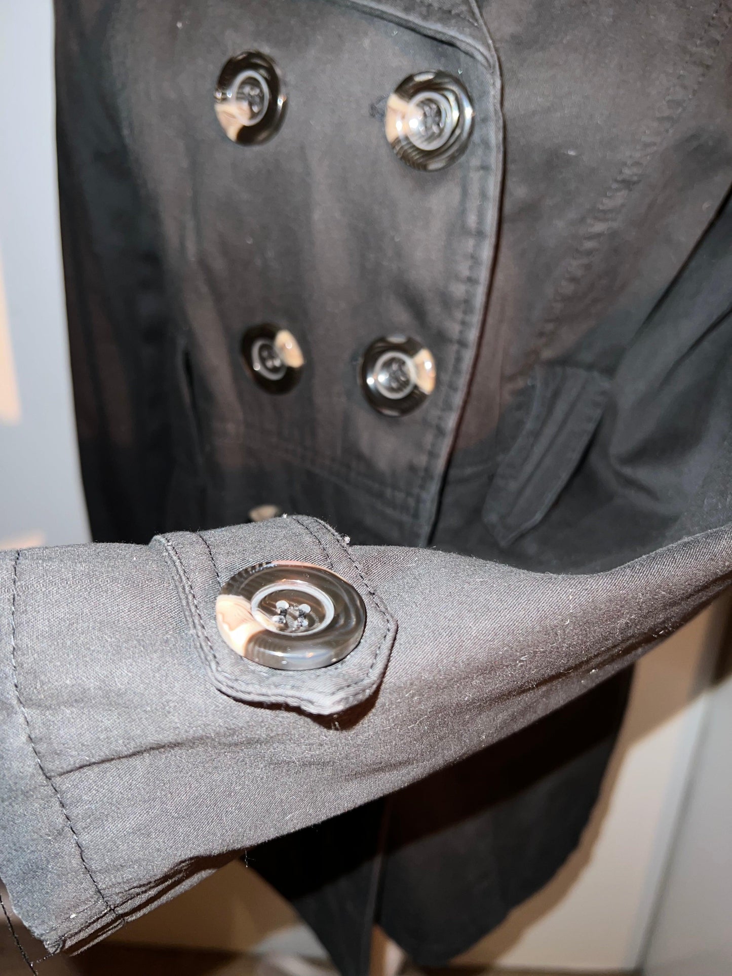 Coat with buttons